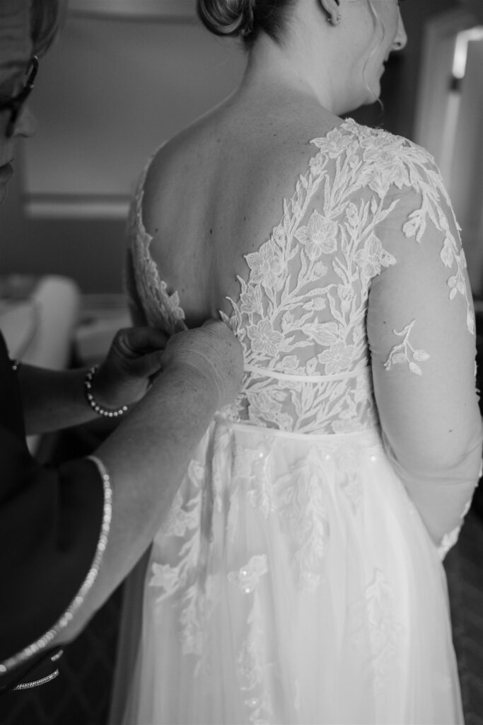bride putting dress on