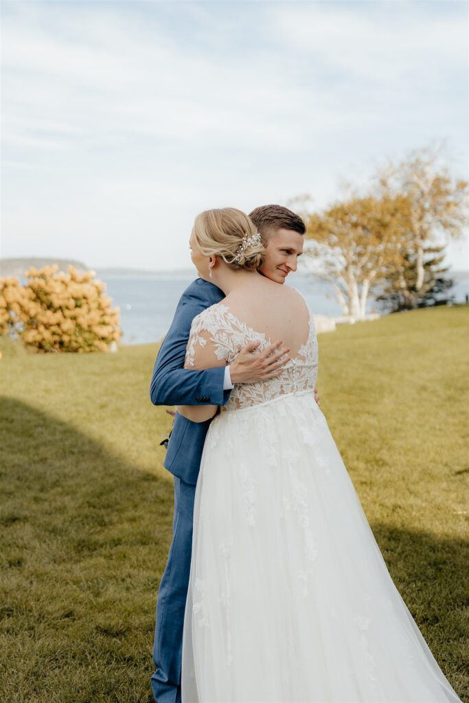 first look with bride and groom outside of Bar Harbor Inn and Spa
