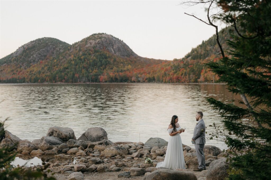Couple reading vows at Jordan Pond 